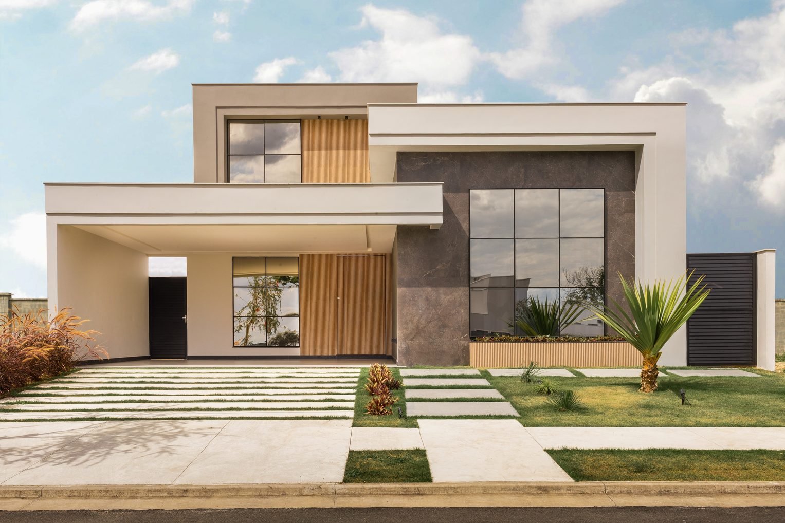 Modern home exterior with large windows, wood accents and a landscaped front yard